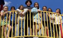 3rd grade students on play structure at recess