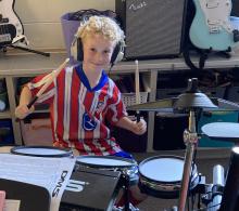2nd grade boy on drum set