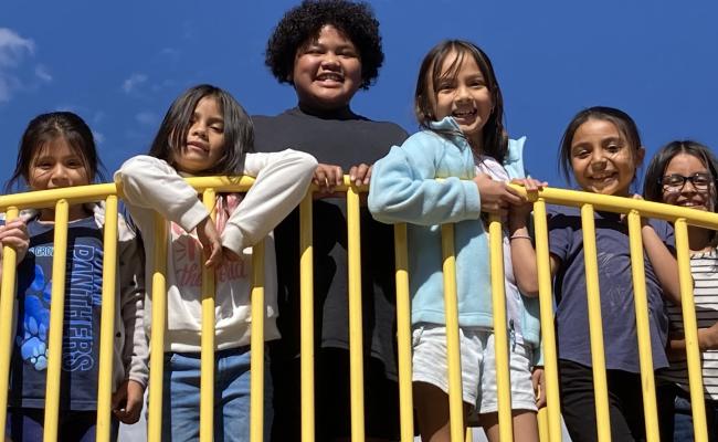 3rd grade students on play structure at recess