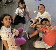 2nd grade students in circle on the floor